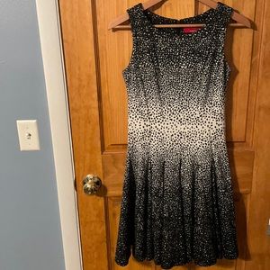 Like new. RED Saks Fifth Ave. size 2. Black cream flared sleeveless dress.